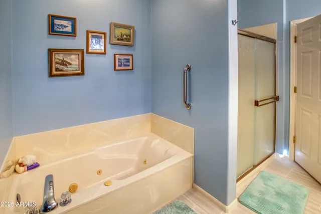 a bedroom with furniture and a potted plant