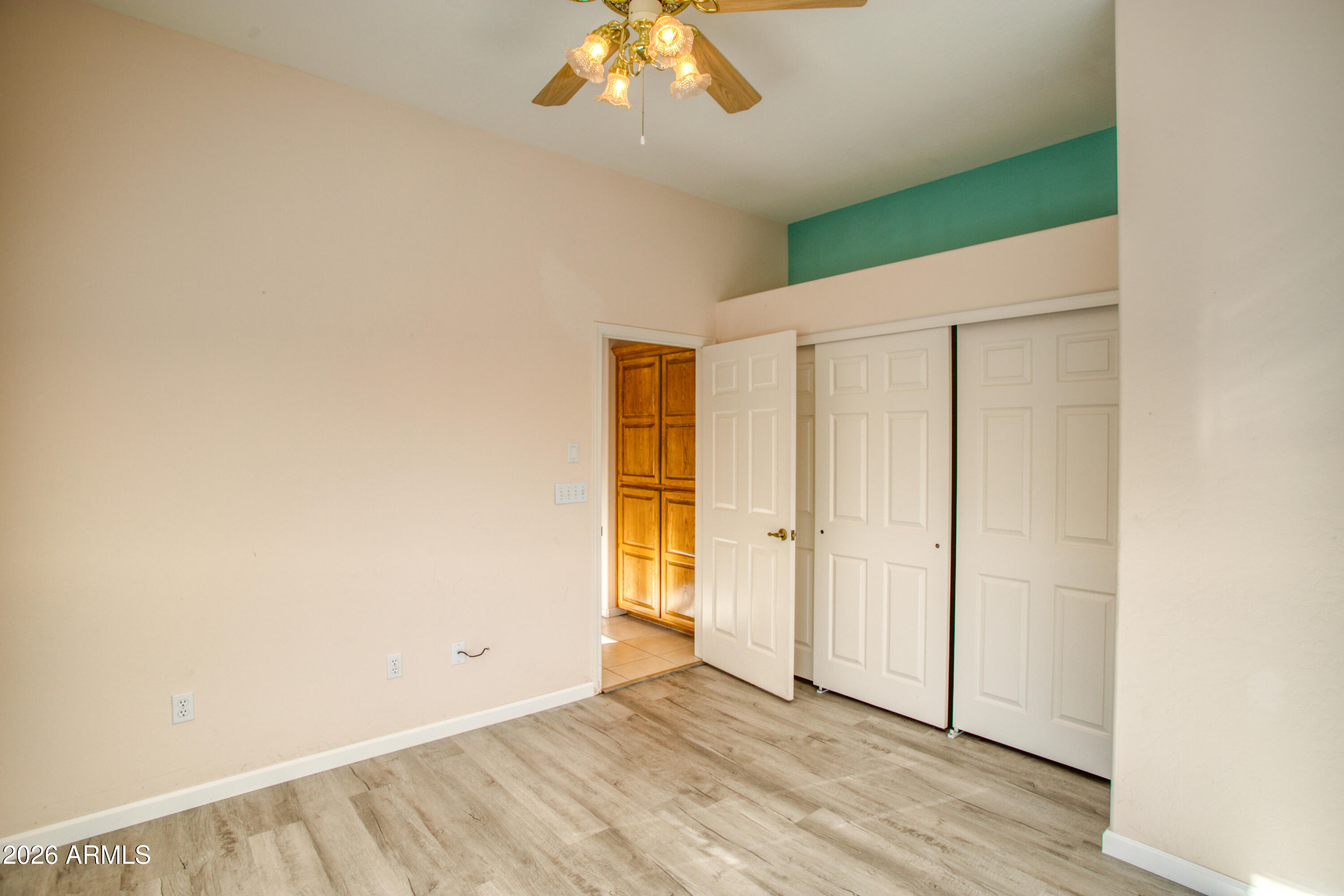 2457 Dragonfly Lane Pinetop-Lakeside, AZ 85929 - Photo 28 of 35 a view of an empty room with wooden floor