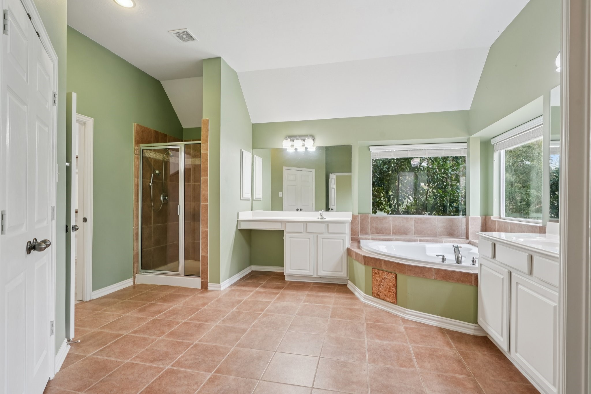 31810 Tree Farm Lane Fulshear, TX 77441 - Photo 20 of 49 Ensuite bathroom with large soaker tub, separate shower, 2 vanities with sinks, water closet and built-in linen closet