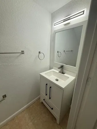 a utility room with a sink dryer and washer