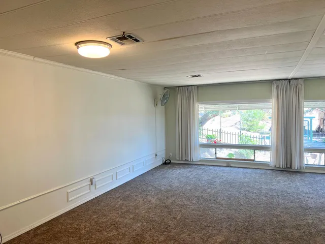 a kitchen with a stove a sink and a refrigerator