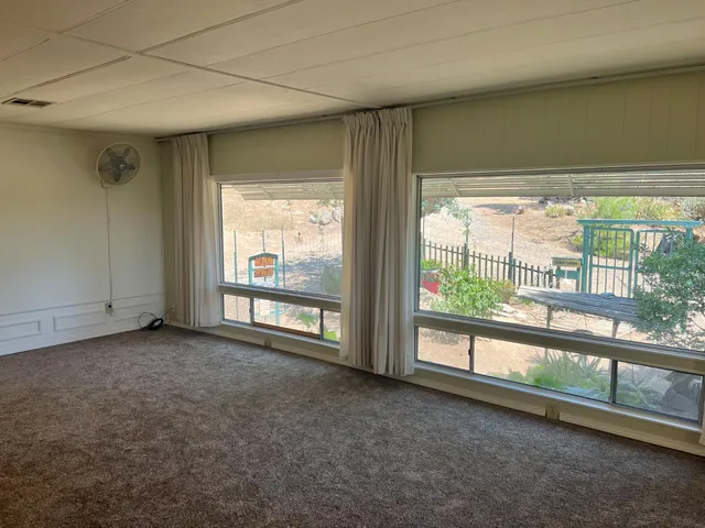 a kitchen with a sink stove and white cabinets