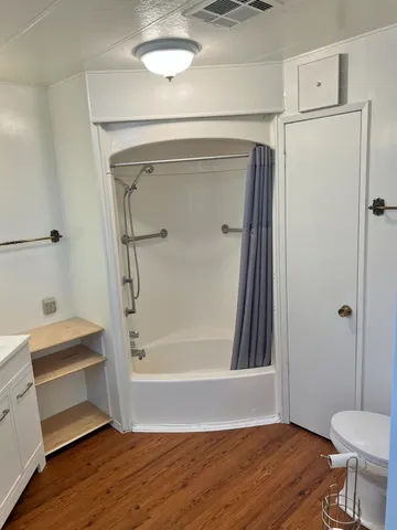 a view of a patio with table and chairs