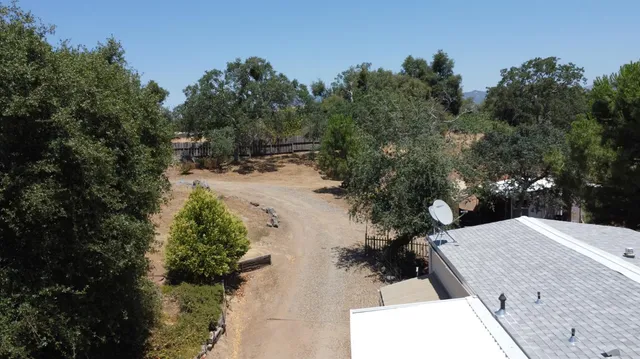 a bathroom with a sink a toilet and shower curtain