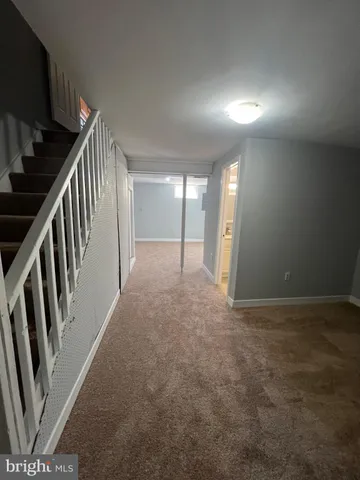 a view of hallway with stairs