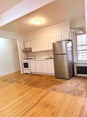 a view of a kitchen with a sink