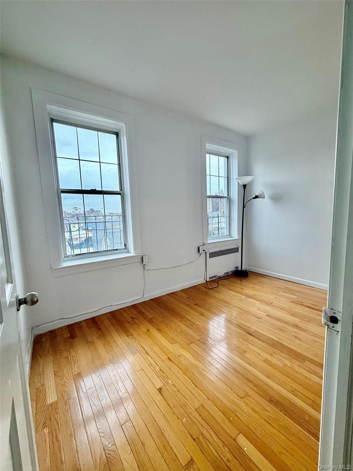 88-11 88th Street, Unit D2 Queens, NY 11373 - Photo 8 of 12 an empty room with windows