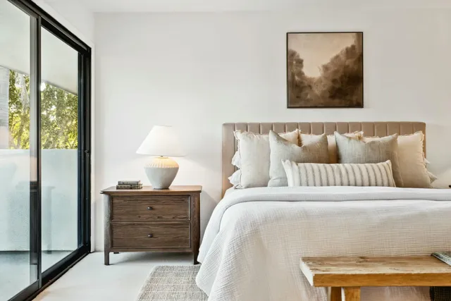 a balcony with table and chairs