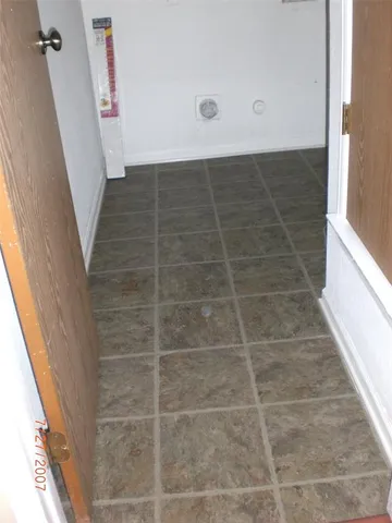 a bathroom with a tub and shower