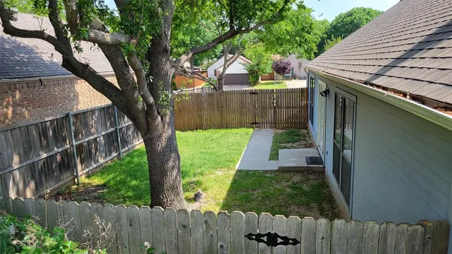 a backyard of a house with lots of green space