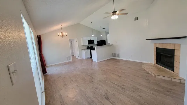 a kitchen with granite countertop a sink and a stove