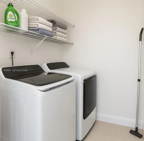 a utility room with dryer and washer