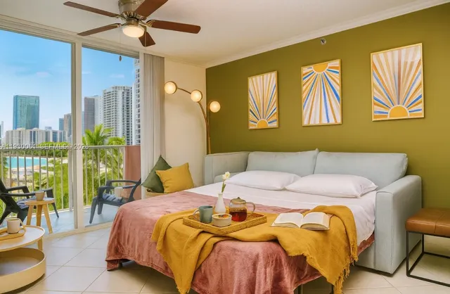 a bedroom with a bed and a painting on the wall