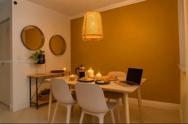 a view of a dining room with furniture and a mirror