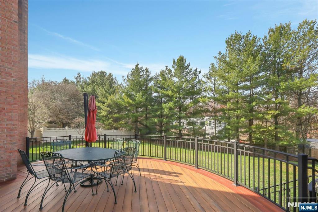 520 Homans Avenue Closter, NJ 07624 - Photo 12 of 34 a view of a chair and table on the deck