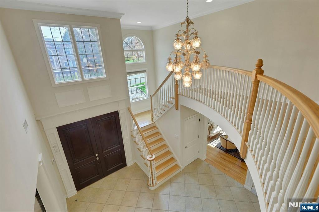 520 Homans Avenue Closter, NJ 07624 - Photo 15 of 34 a living room with furniture and a chandelier