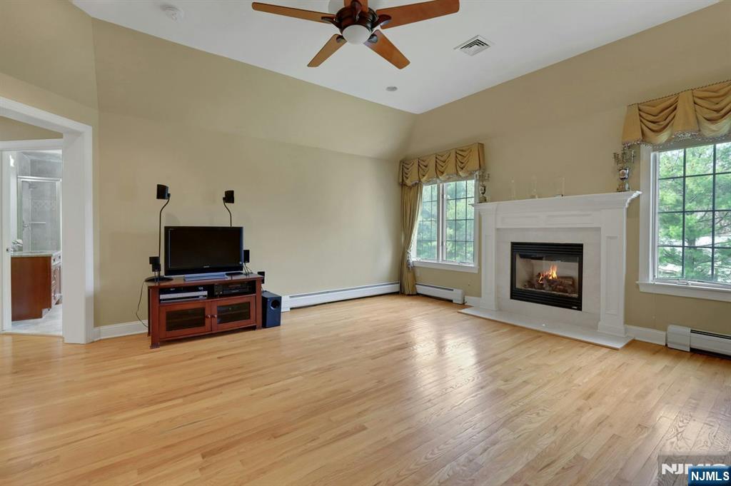 520 Homans Avenue Closter, NJ 07624 - Photo 17 of 34 a view of a livingroom with a fireplace and wooden floor