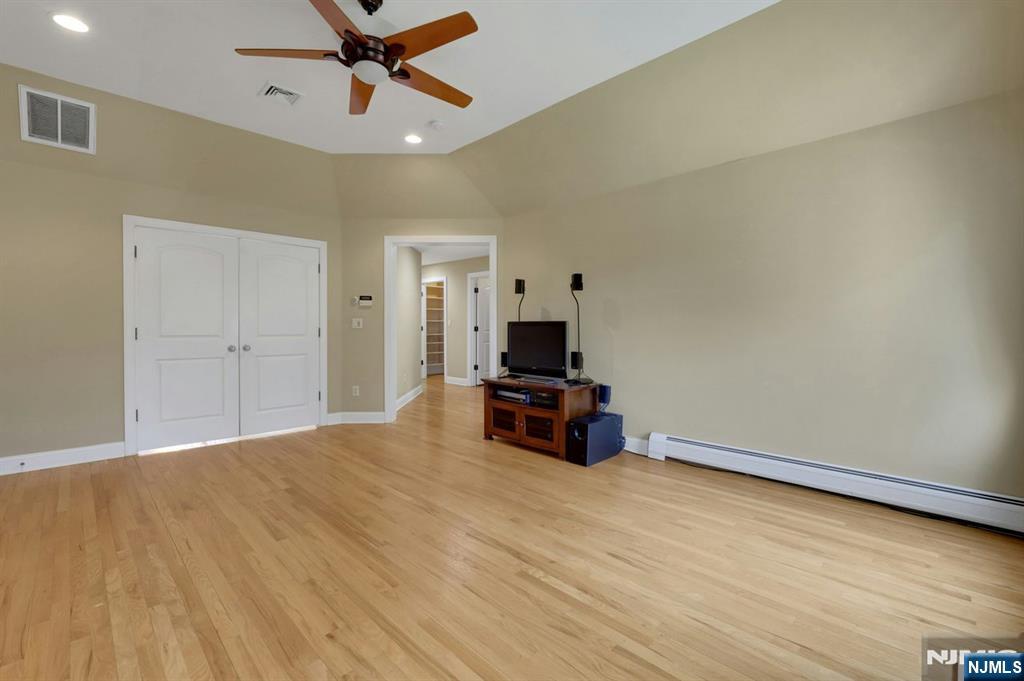 520 Homans Avenue Closter, NJ 07624 - Photo 18 of 34 a living room with furniture and a ceiling fan