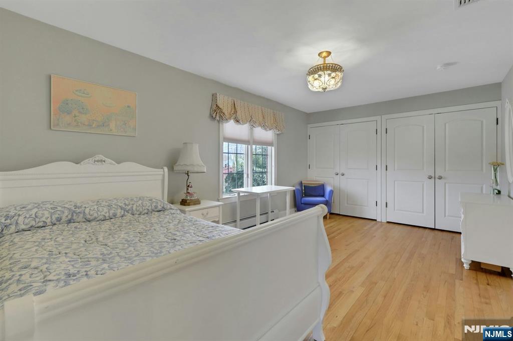 520 Homans Avenue Closter, NJ 07624 - Photo 27 of 34 a bedroom with a bed and a window