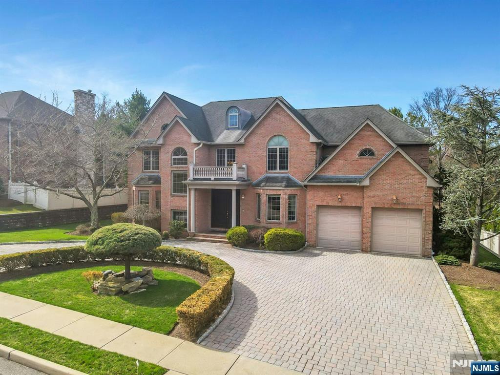 520 Homans Avenue Closter, NJ 07624 - Photo 32 of 34 a front view of a house with garden