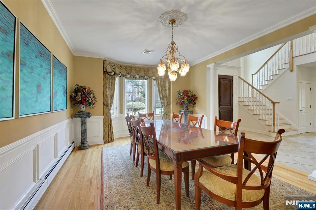 520 Homans Avenue Closter, NJ 07624 - Photo 6 of 34 a view of a dining room and livingroom with furniture wooden floor a chandelier