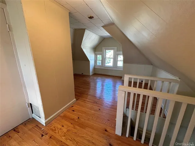 a view of entryway with stairs and wooden floor