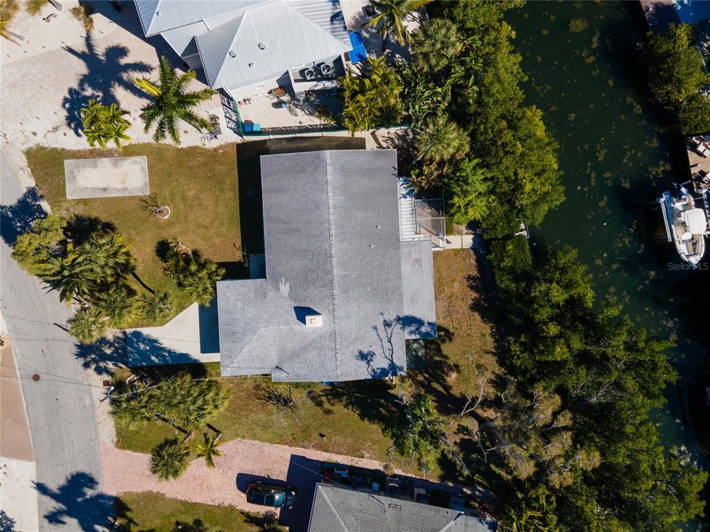 507 58th Street Holmes Beach, FL 34217 - Photo 12 of 19 an aerial view of a residential houses with yard