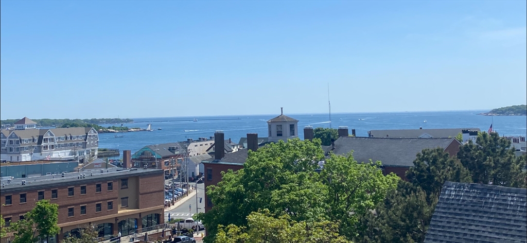 35 Middle Street, Unit 4 Gloucester, MA 01930 - Photo 26 of 28 a view of a city with tall buildings in the background