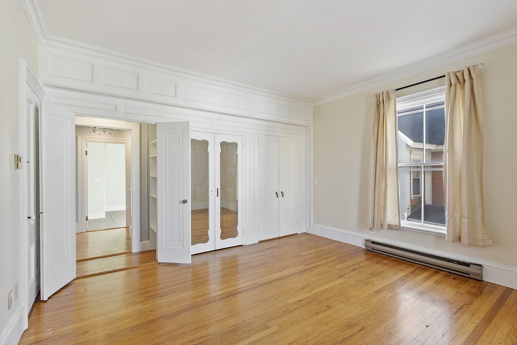 35 Middle Street, Unit 4 Gloucester, MA 01930 - Photo 5 of 28 a view of empty room with wooden floor and fan