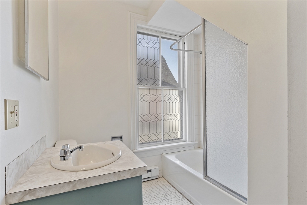 35 Middle Street, Unit 4 Gloucester, MA 01930 - Photo 8 of 28 a bathroom with a sink and a mirror