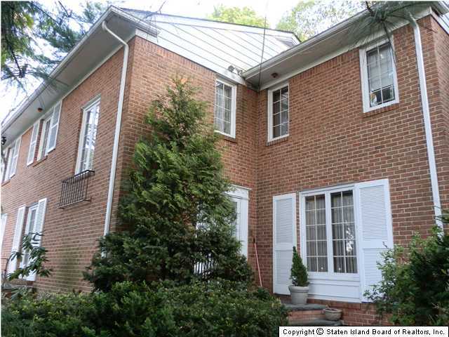 275 Douglas Road Staten Island, NY 10304 - Photo 3 of 11 a view of a house with a yard and plants