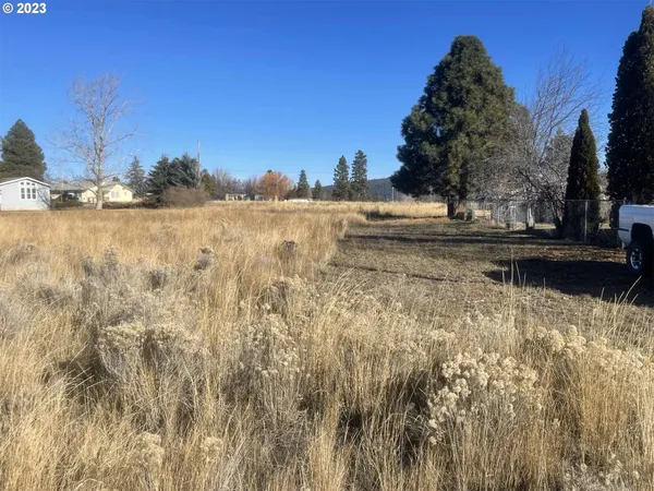 a view of lake with lots of tress in background