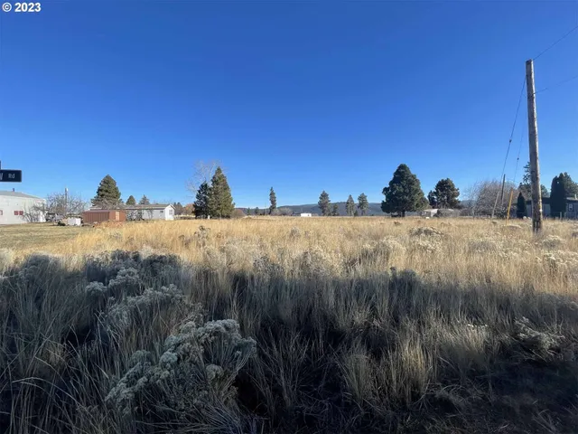 a view of a lake with a house in background