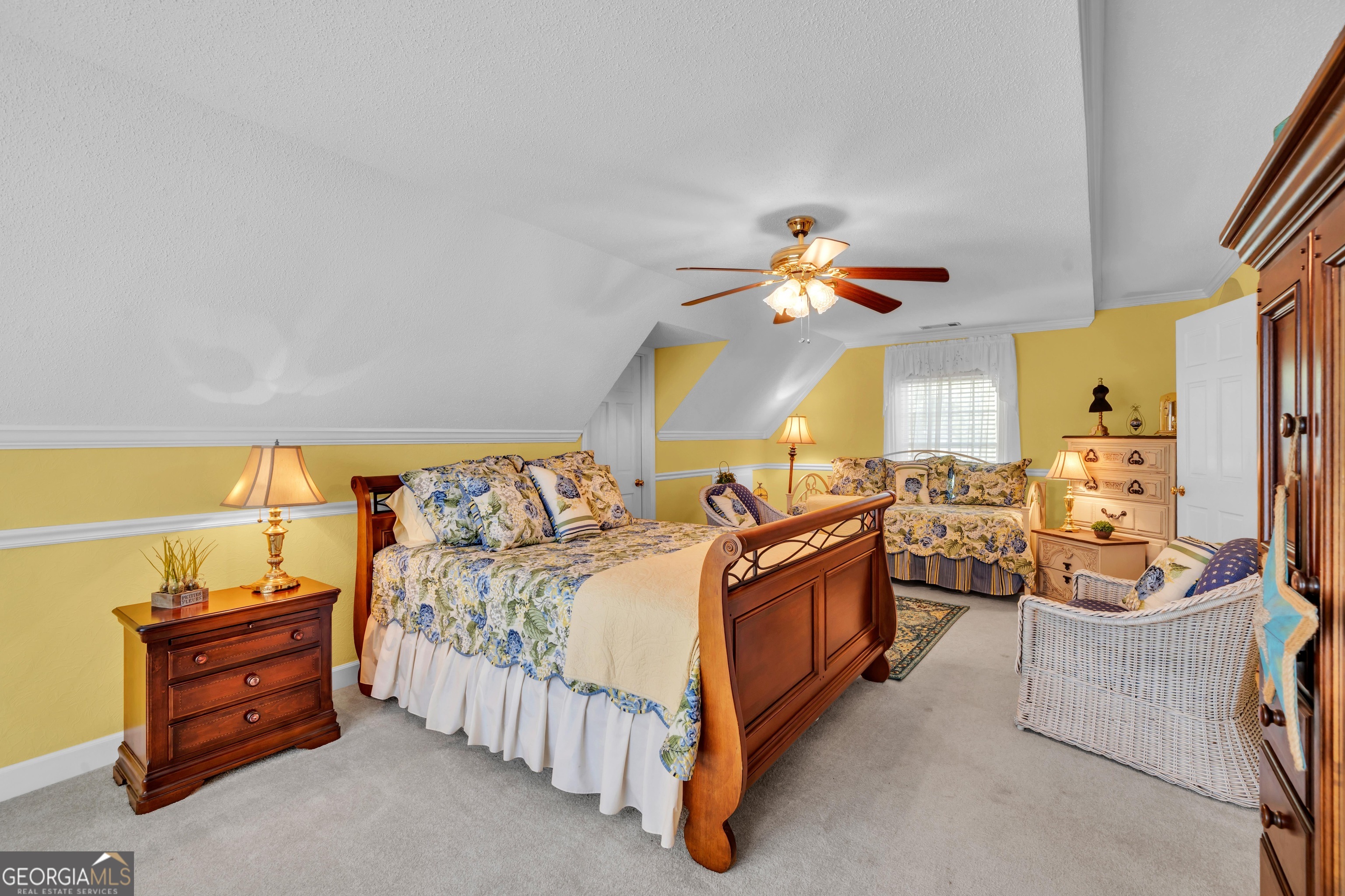 87 Georgia Avenue Adrian, GA 31002 - Photo 58 of 74 a bedroom with a bed and a chandelier