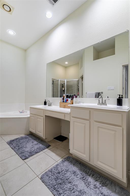 18240 Midway Road, Unit 1004 Dallas, TX 75287 - Photo 15 of 22 a bathroom with a sink mirror and a