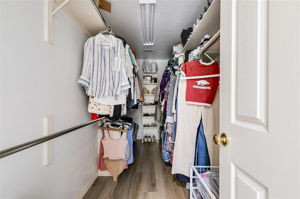 18240 Midway Road, Unit 1004 Dallas, TX 75287 - Photo 17 of 22 a view of gym equipment with wooden floor