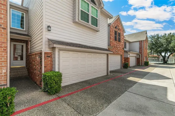 a front view of a house with a garage