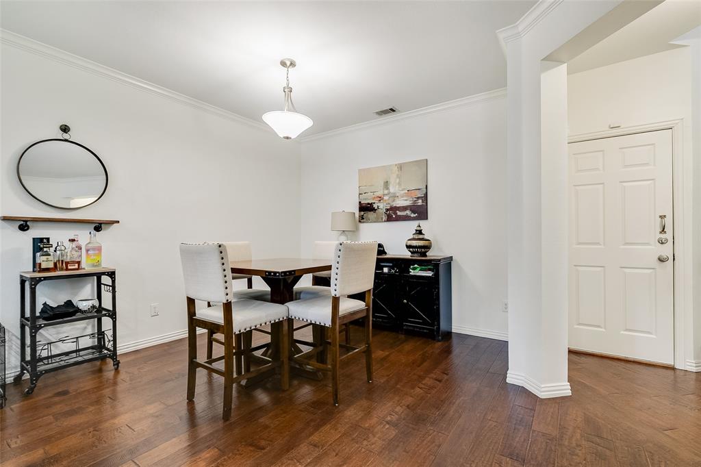 18240 Midway Road, Unit 1004 Dallas, TX 75287 - Photo 6 of 22 a view of a dining room with furniture and wooden floor