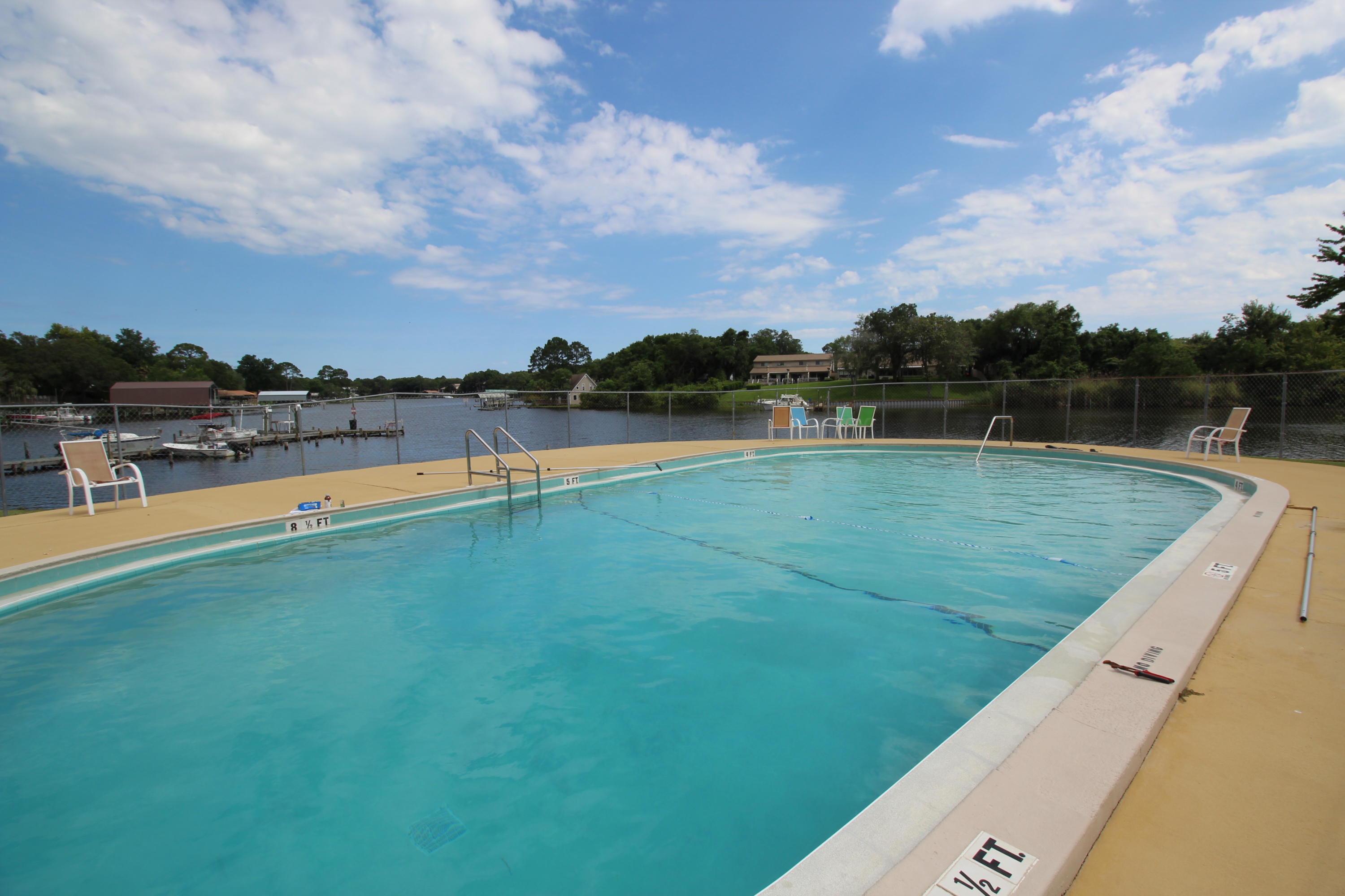 210 Pelham Road, Unit 218A Fort Walton Beach, FL 32547 - Photo 14 of 16 a view of swimming pool with a lake view
