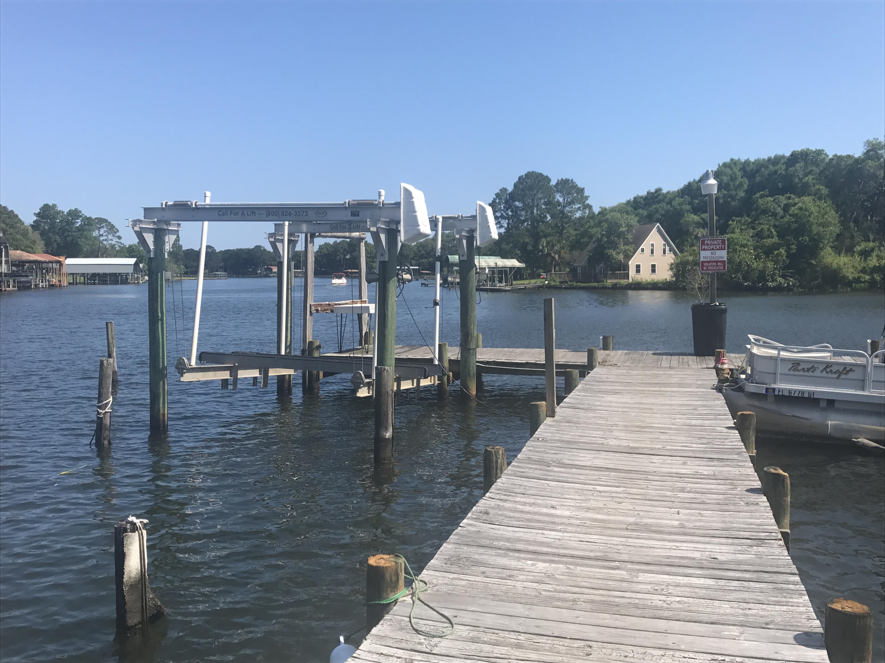 210 Pelham Road, Unit 218A Fort Walton Beach, FL 32547 - Photo 15 of 16 a view of a patio with lake view