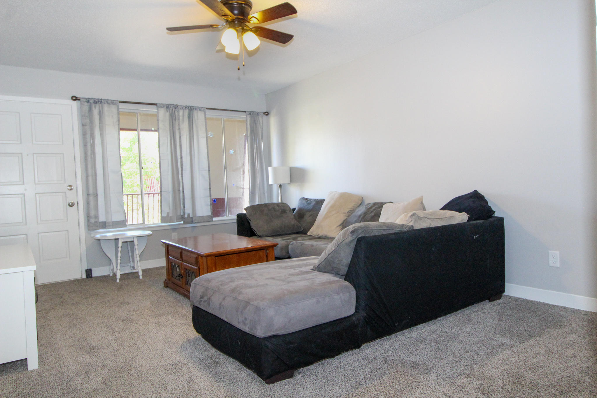 210 Pelham Road, Unit 218A Fort Walton Beach, FL 32547 - Photo 2 of 16 a living room with furniture and a window