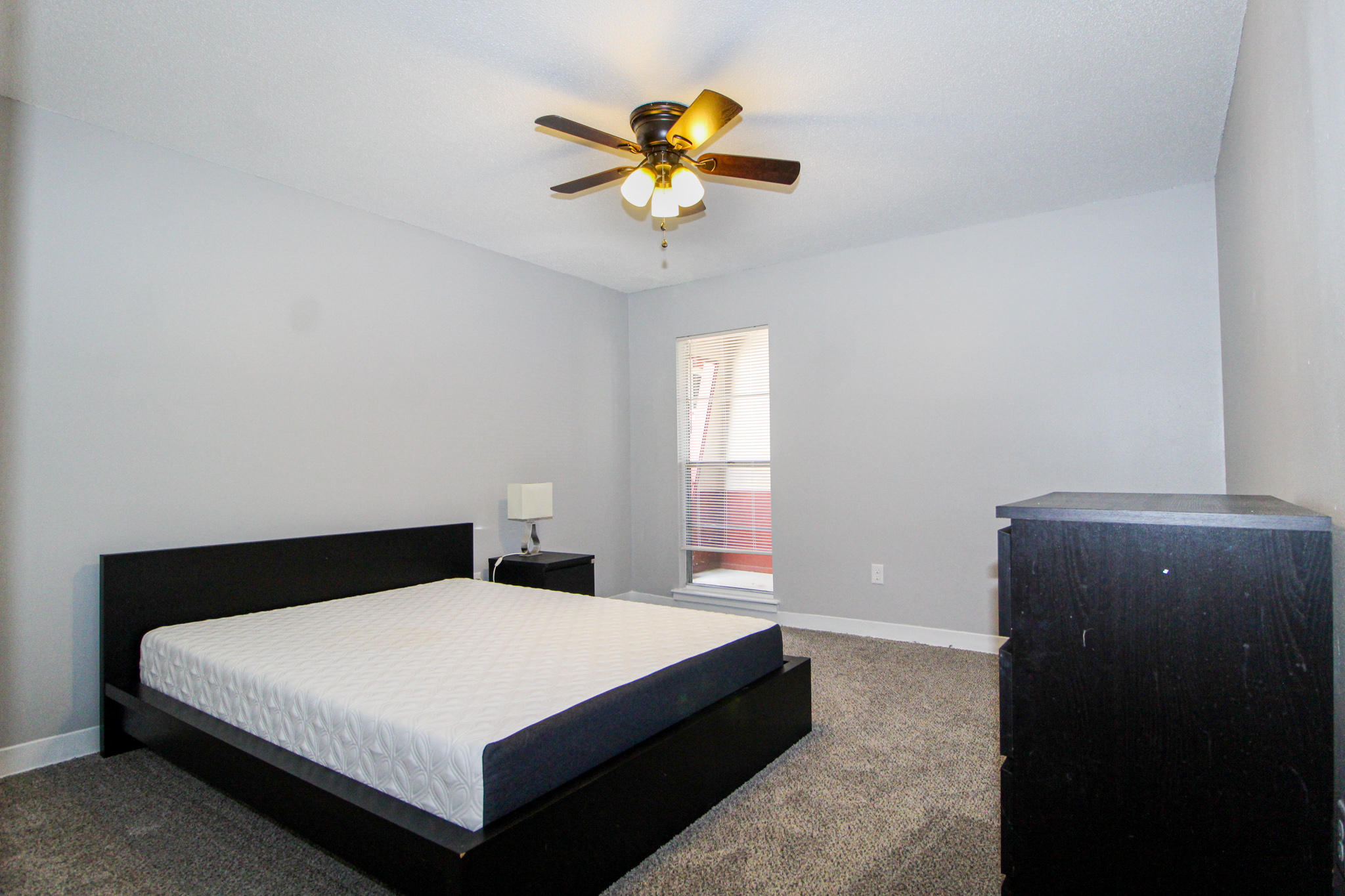 210 Pelham Road, Unit 218A Fort Walton Beach, FL 32547 - Photo 8 of 16 a bedroom with a bed and window