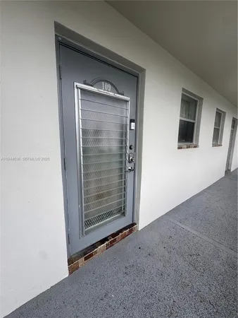 a view of empty room with window and fireplace