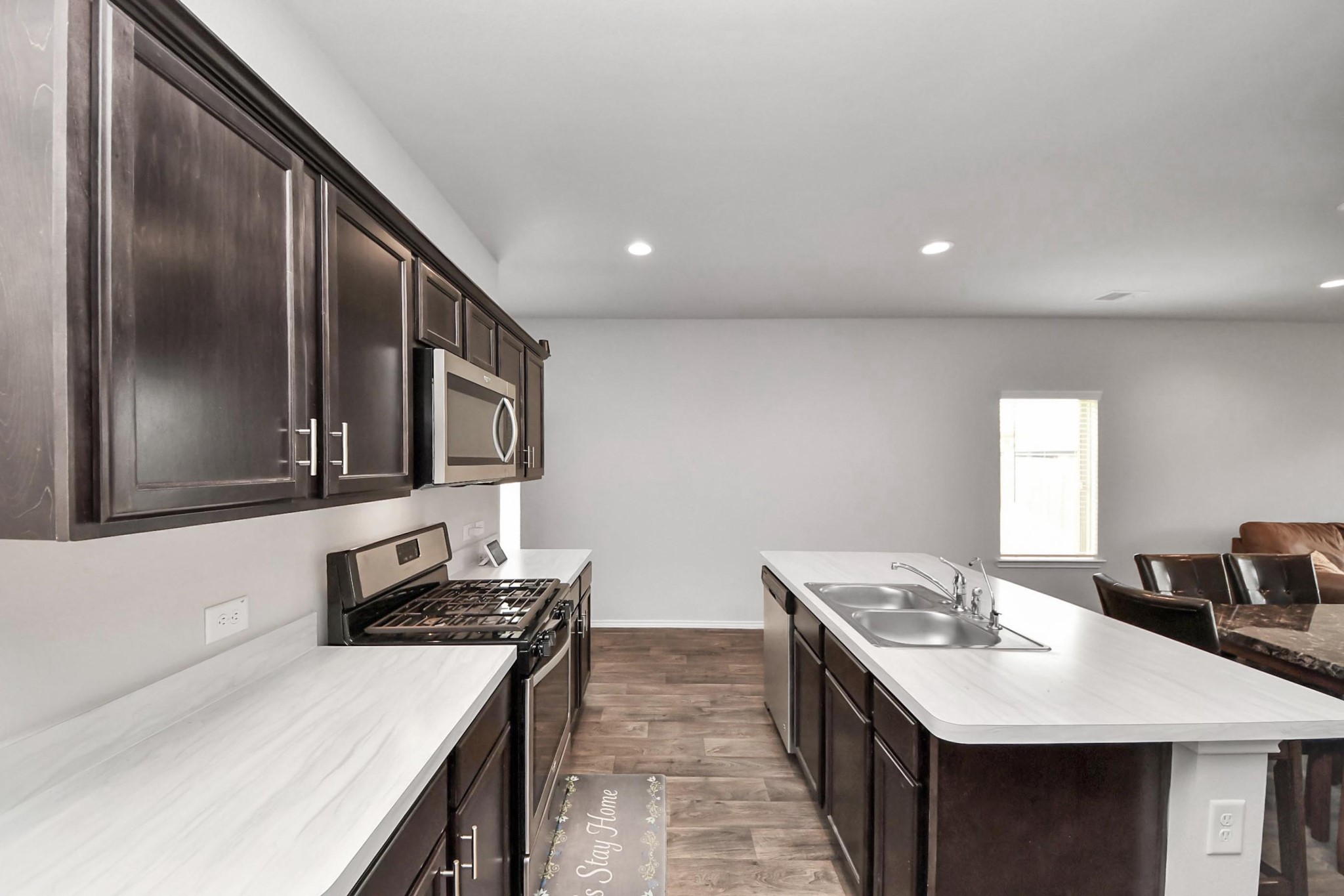 2347 Pettingell Way Spring Spring, TX 77373 - Photo 17 of 41 Elegant kitchen showcasing granite counters, center island, and recessed lighting.
