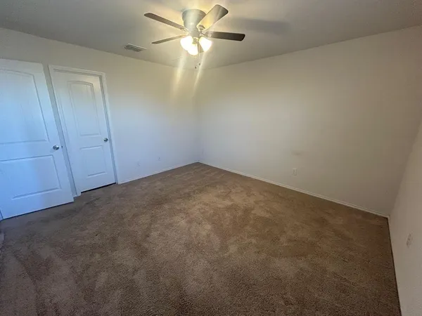 a living room with a sink furniture and wooden floor