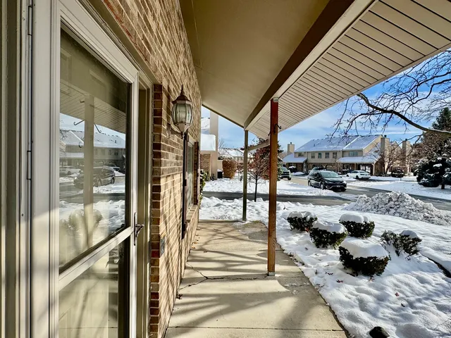 a outdoor view of a building with traffic signal lights