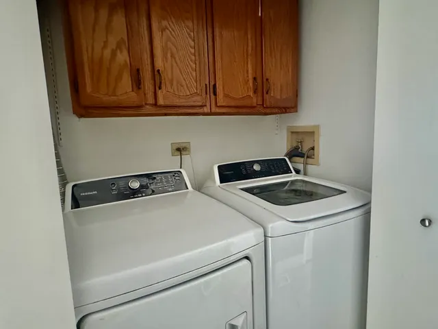 a utility room with dryer and washer