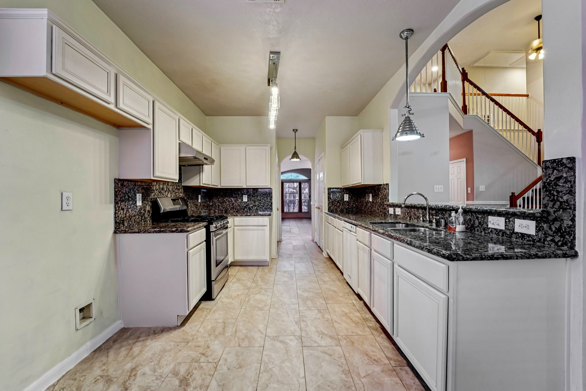 3818 Ridge Canyon Road Baytown, TX 77521 - Photo 4 of 32 a large kitchen with stainless steel appliances kitchen island granite countertop a stove a sink and dishwasher