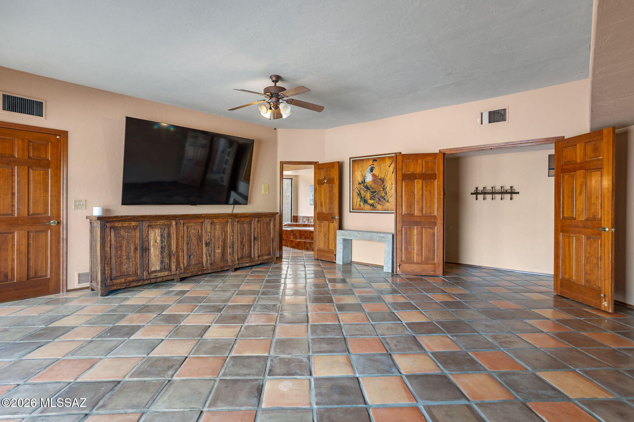 7171 South X9 Ranch Road Vail, AZ 85641 - Photo 18 of 50 All tiled Primary Suite with ensuite. Slate table, TV incl. Console negotiable.