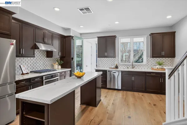a view of a chairs and table in the patio